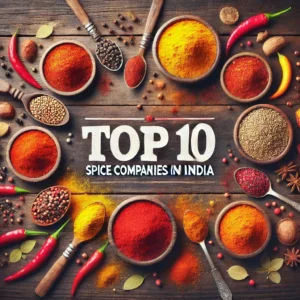 An assortment of vibrant Indian spices like red chili powder, turmeric, cumin, and coriander arranged in bowls on a rustic wooden background with the text 'Top 10 Spice Companies in India' overlaid